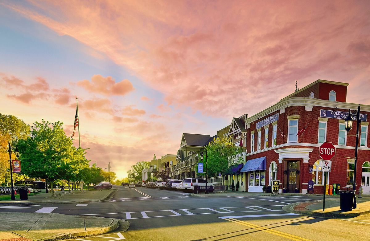 Brick storefronts and a quiet intersection in downtown Blue Ridge at sunset