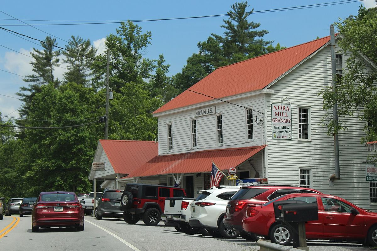 The white clapboard Nora Mill Granary building with a red roof